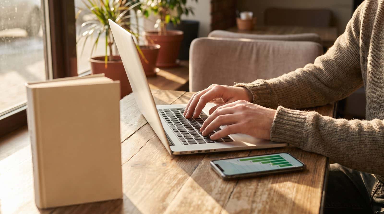 Drafting a mystery story chapter on a laptop