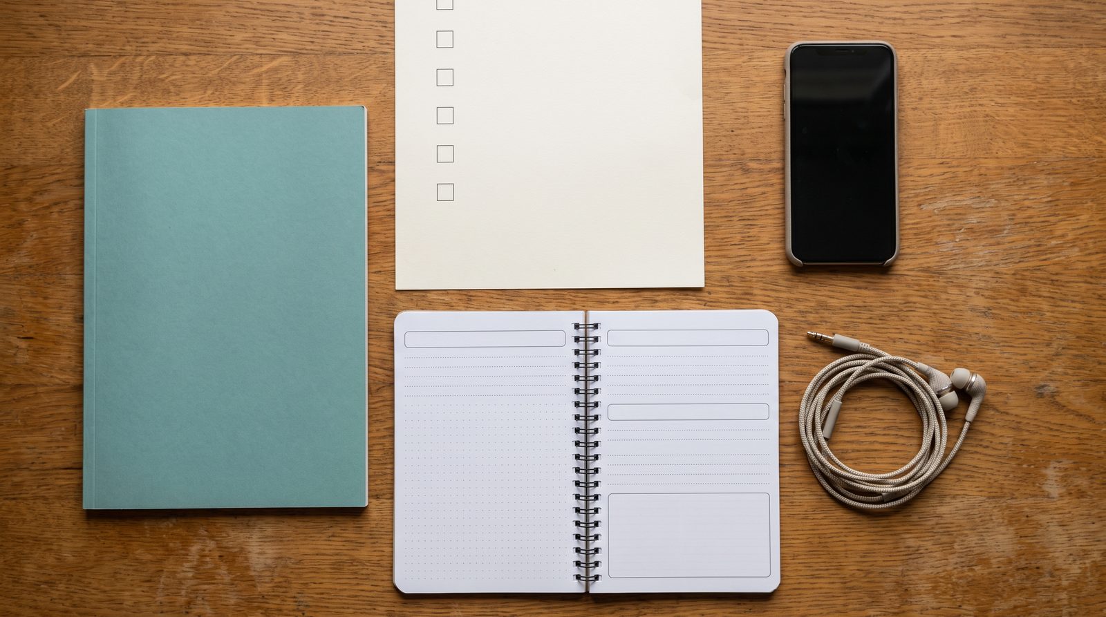 Lead magnet ebook, checklist, and workbook formats on a desk